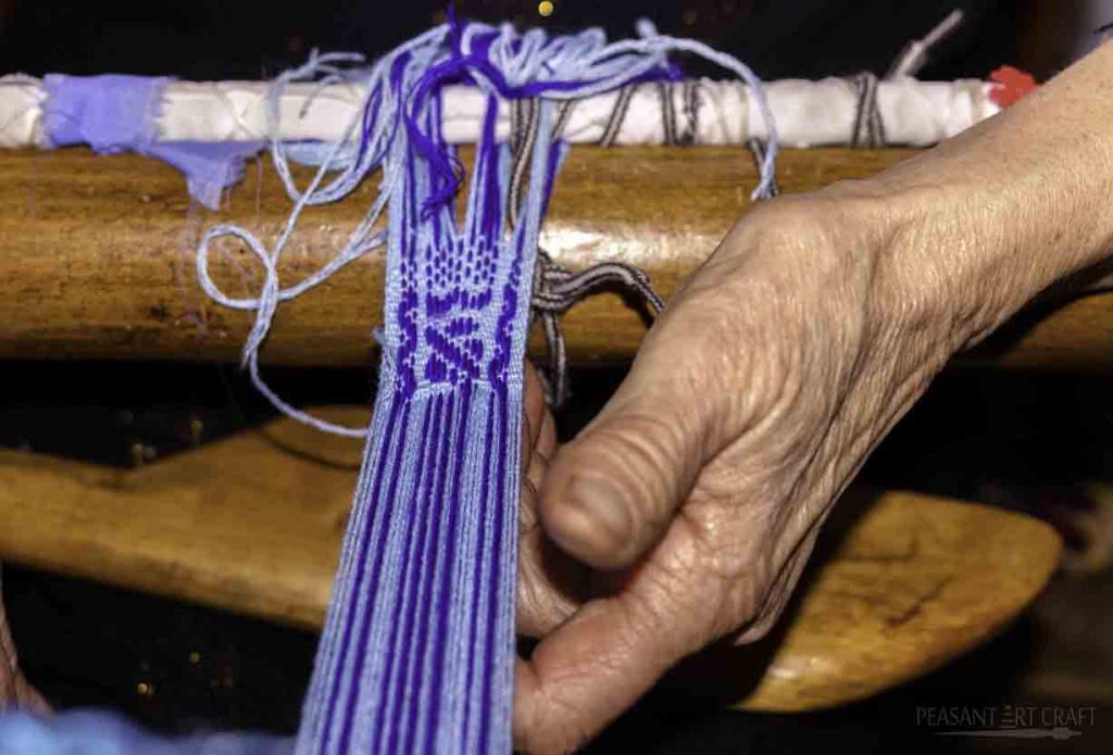 Craft Worker Hand Weaving on Floor Loom