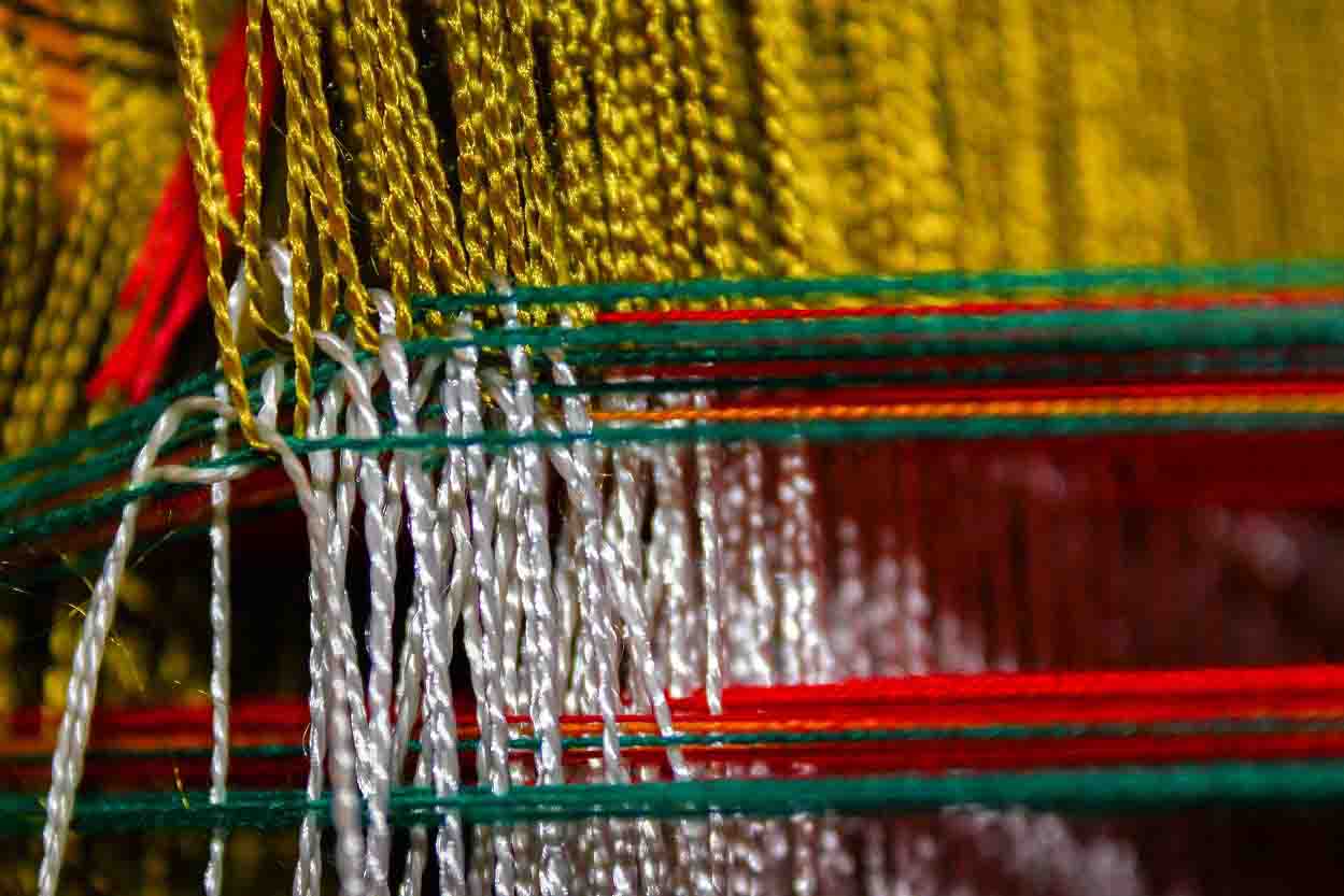 Loom Weaver Handcrafting Traditional Clothing for Village Community