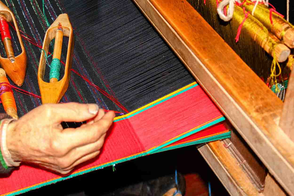 Loom Weaver Handcrafting Traditional Clothing for Village Community