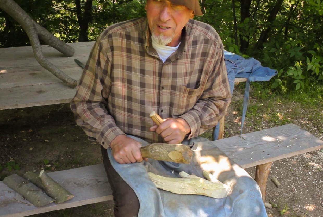 Wood Artisan Carving a Wooden Spirit