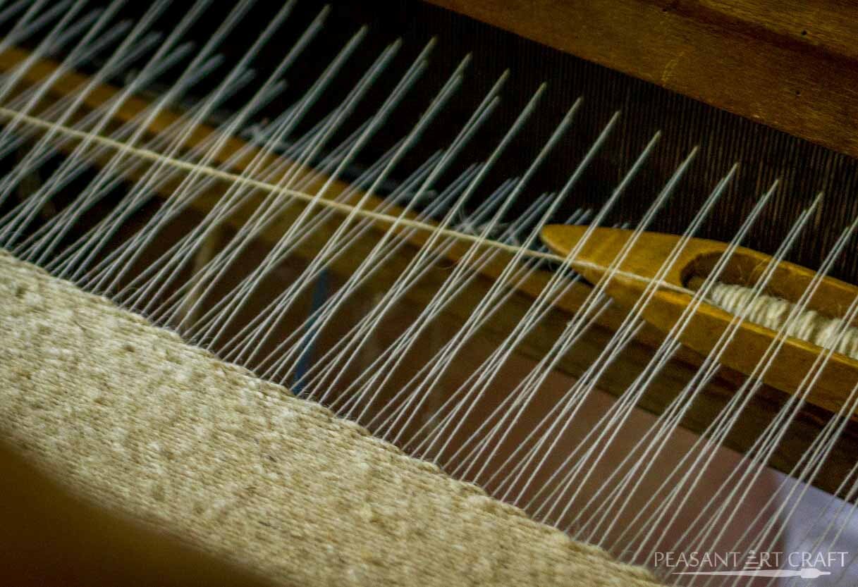 Traditional Textile Weaving Demonstration in Romanian Village of Straja