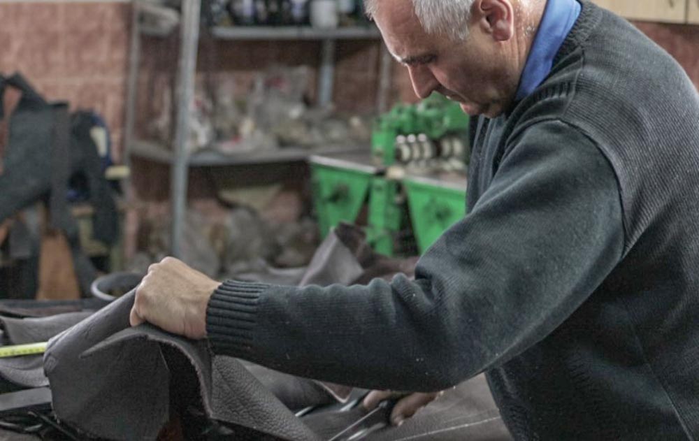 Horse Harness Making With Brass Ornaments in Rural Leather Workshop