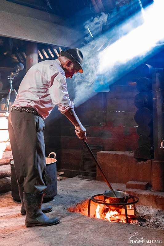 Shepherd Stirring Cauldron Over Fire