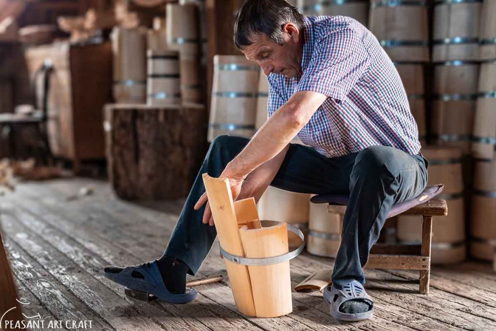 Traditional Cooper Constructing Barrel Raising the Staves